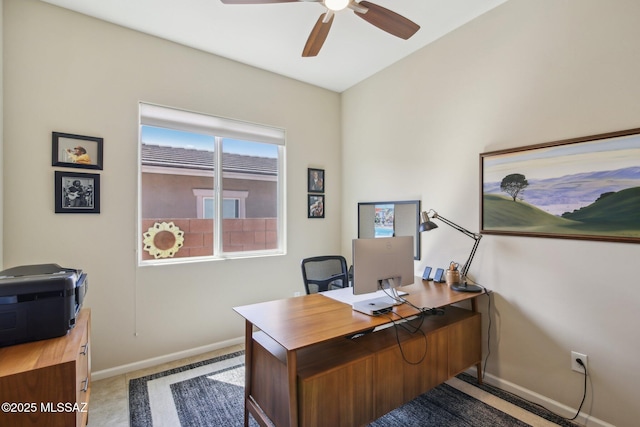 office area featuring baseboards and a ceiling fan