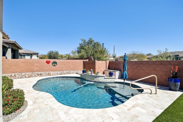 view of pool featuring a fenced in pool, a patio, and a fenced backyard