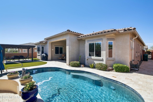 back of house featuring a fenced in pool, stucco siding, a patio area, a tiled roof, and fence