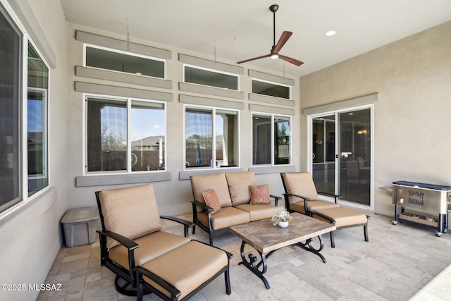 view of patio featuring an outdoor hangout area and ceiling fan