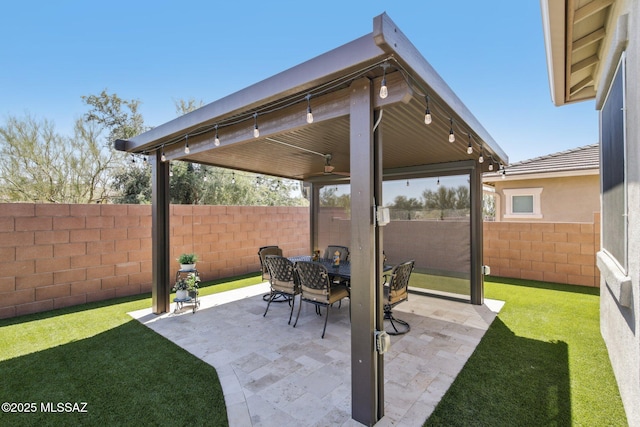 view of patio / terrace with outdoor dining space and fence