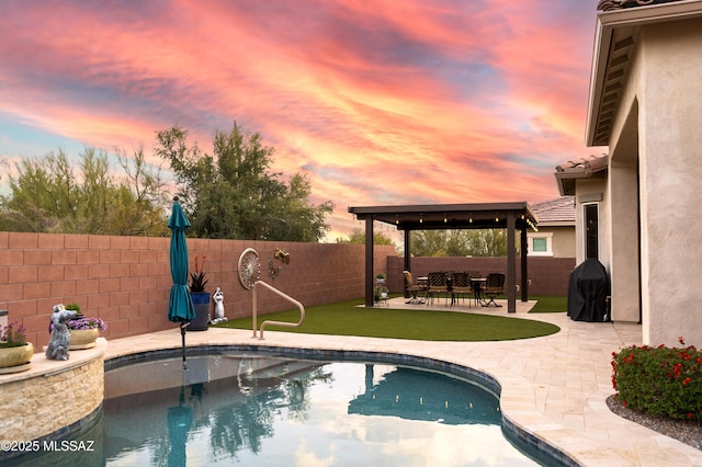 pool at dusk with a gazebo, area for grilling, a fenced backyard, a patio, and a fenced in pool
