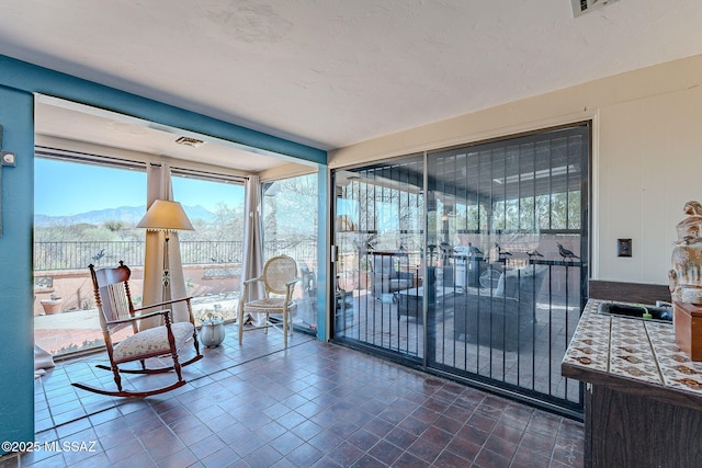 interior space with visible vents and a mountain view