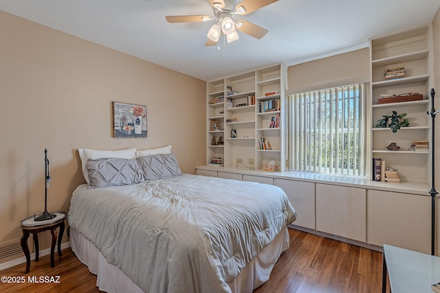 bedroom with wood finished floors, baseboards, and ceiling fan