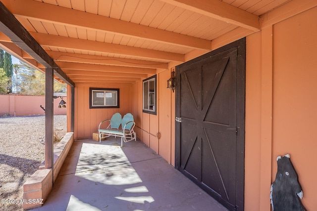 view of patio featuring fence