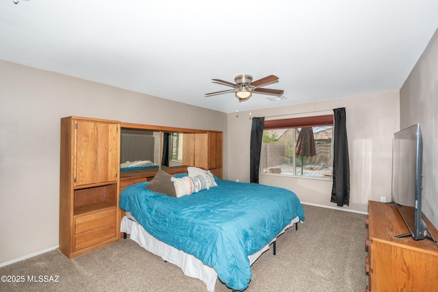 bedroom featuring baseboards, ceiling fan, and carpet floors