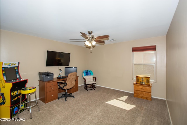 office featuring baseboards, carpet floors, ceiling fan, and visible vents