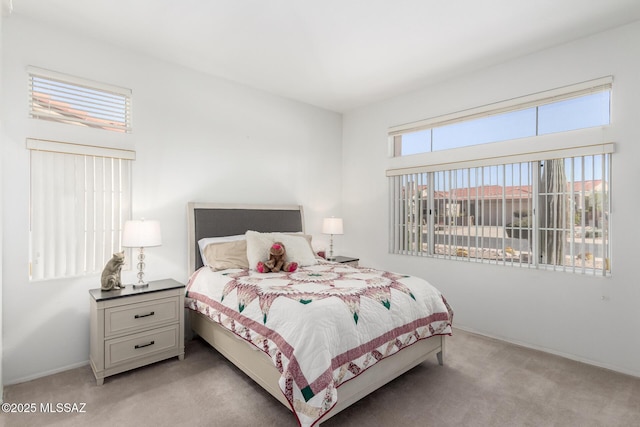 bedroom with light carpet