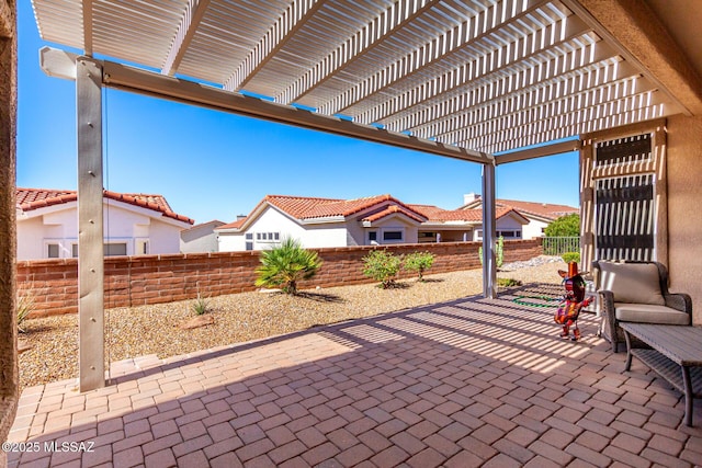 view of patio featuring a fenced backyard and a pergola