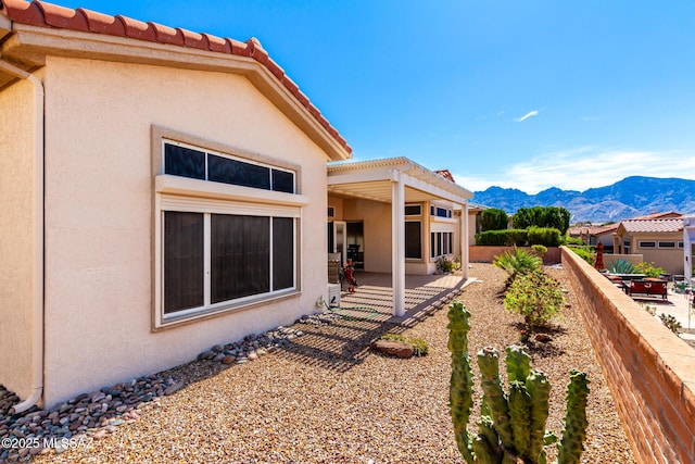view of yard with a pergola, fence, a patio area, and a mountain view