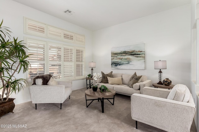 living room featuring carpet flooring and visible vents
