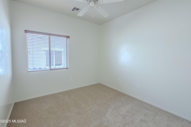 unfurnished room featuring baseboards, carpet flooring, ceiling fan, and visible vents