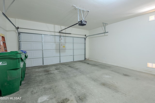 garage featuring a garage door opener