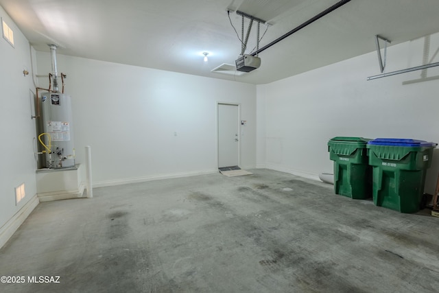 garage featuring a garage door opener and gas water heater
