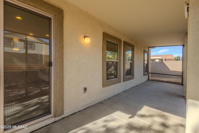 view of patio featuring fence