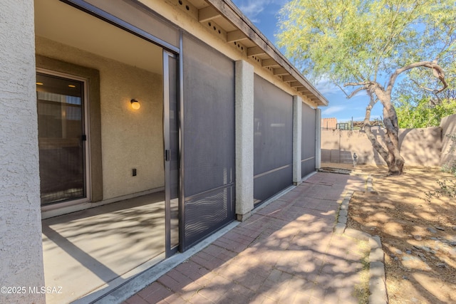 view of patio / terrace featuring fence