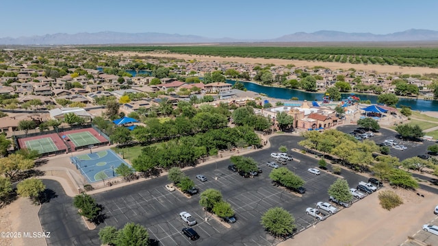 drone / aerial view with a water and mountain view