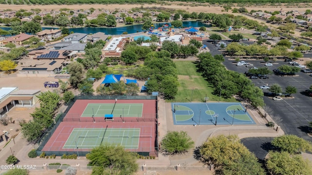 birds eye view of property with a water view