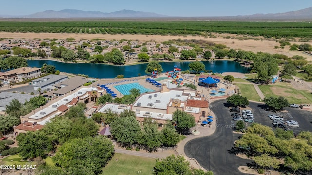 drone / aerial view with a water and mountain view