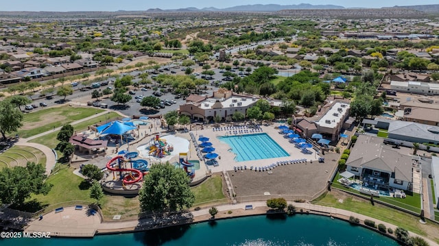 aerial view featuring a residential view and a water and mountain view