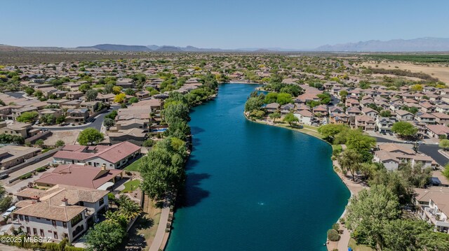 birds eye view of property with a residential view and a water and mountain view