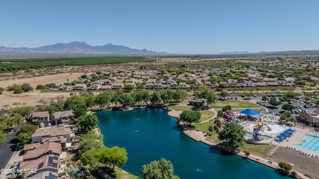 birds eye view of property featuring a residential view and a water and mountain view