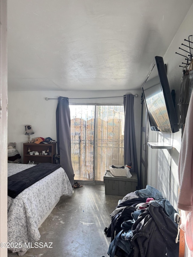 bedroom with concrete flooring