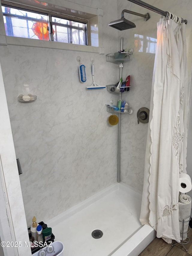 bathroom featuring a shower stall