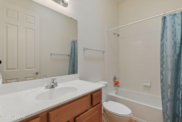 bathroom featuring shower / bath combination with curtain, vanity, and toilet