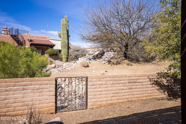 view of yard featuring a gate and fence