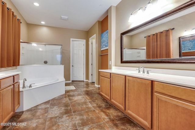 full bath with a bath, a shower stall, baseboards, recessed lighting, and vanity