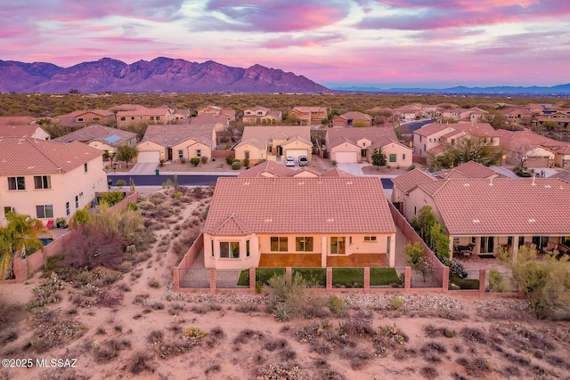 aerial view at dusk with a residential view and a mountain view