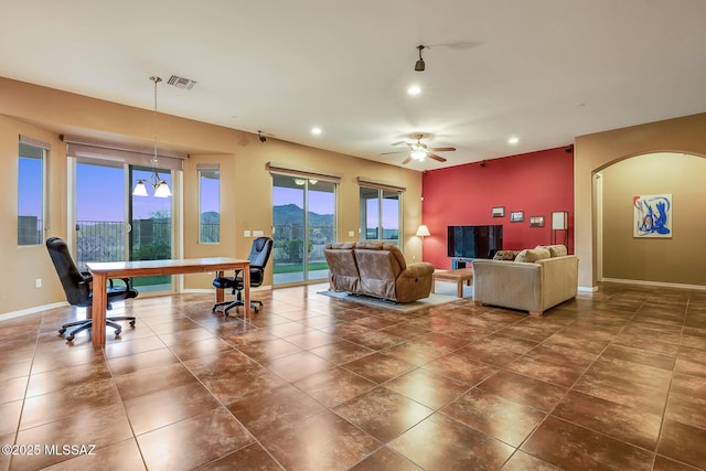 living room with visible vents, baseboards, ceiling fan, recessed lighting, and arched walkways