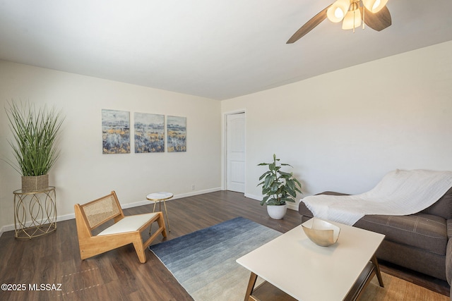 living room with a ceiling fan, wood finished floors, and baseboards