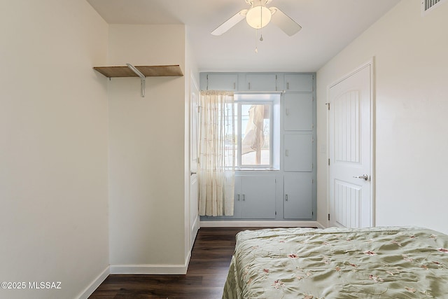 bedroom featuring baseboards, visible vents, a ceiling fan, and dark wood-style flooring