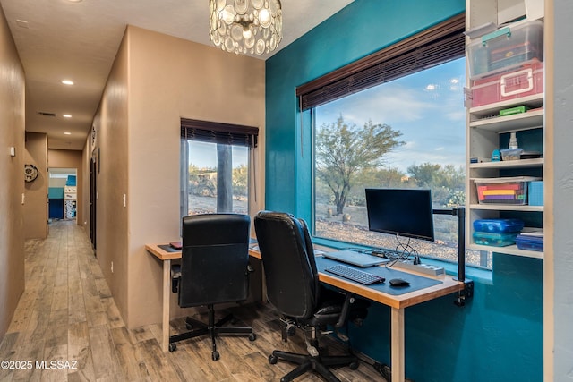 office with an inviting chandelier, recessed lighting, wood finished floors, and visible vents