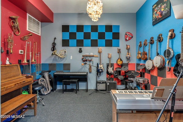 misc room with visible vents and an inviting chandelier