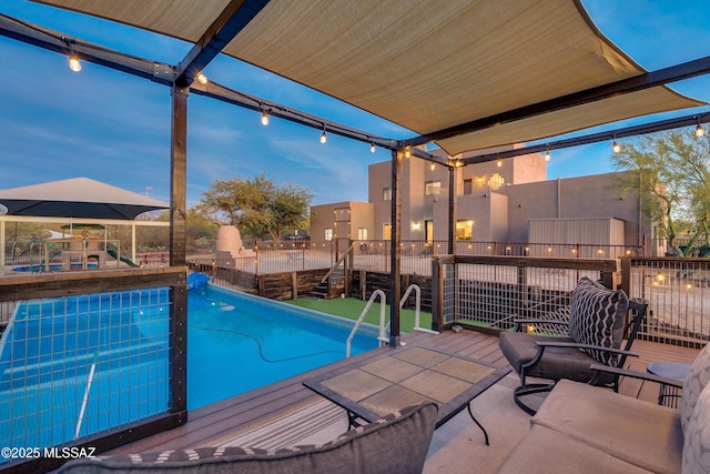 view of swimming pool featuring a fenced in pool