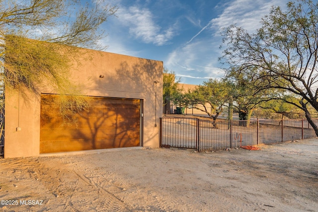 garage featuring fence