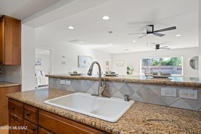 2350 E Juanita St, Tucson, AZ 85719 - kitchen featuring a sink, brown cabinets, recessed lighting, and a ceiling fan