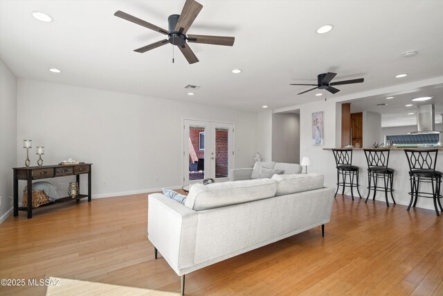 2350 E Juanita St, Tucson, AZ 85719 - living area featuring a ceiling fan, recessed lighting, light wood-type flooring, and baseboards