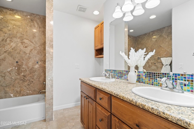 2350 E Juanita St, Tucson, AZ 85719 - full bath with double vanity, decorative backsplash, washtub / shower combination, a chandelier, and tile patterned flooring