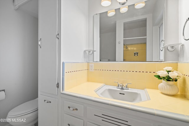 2350 E Juanita St, Tucson, AZ 85719 - bathroom featuring decorative backsplash, toilet, and vanity