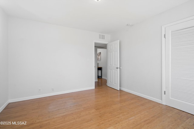 2350 E Juanita St, Tucson, AZ 85719 - unfurnished bedroom with light wood-style flooring and baseboards