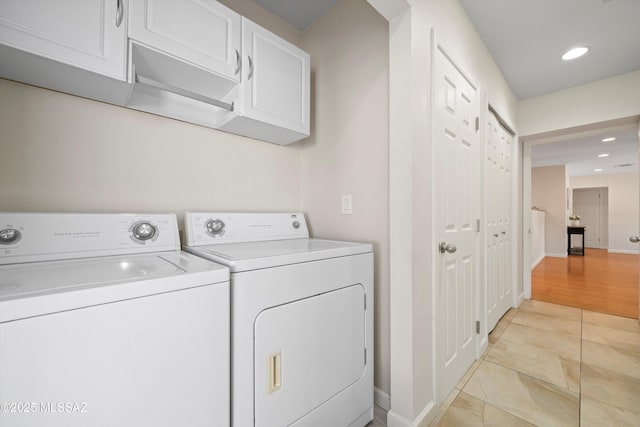2350 E Juanita St, Tucson, AZ 85719 - laundry room featuring washer and dryer, baseboards, cabinet space, and recessed lighting