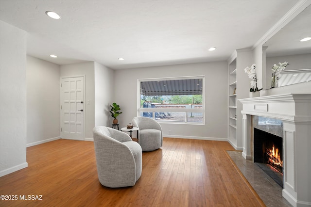 2350 E Juanita St, Tucson, AZ 85719 - sitting room with a fireplace, hardwood / wood-style floors, baseboards, recessed lighting, and built in features