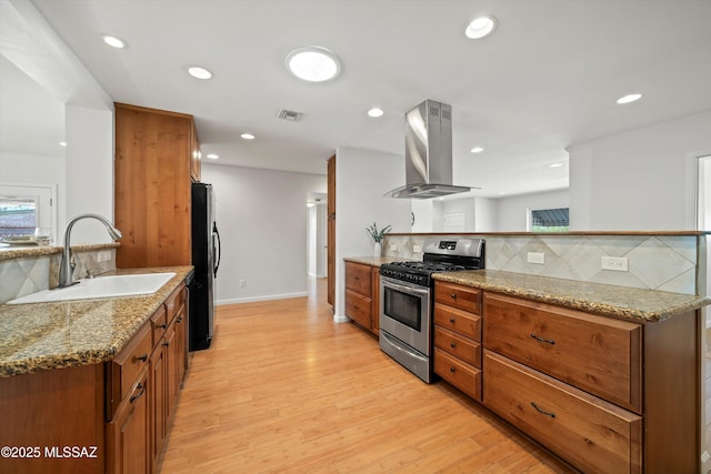 2350 E Juanita St, Tucson, AZ 85719 - kitchen featuring stainless steel gas range oven, island range hood, a sink, a peninsula, and recessed lighting