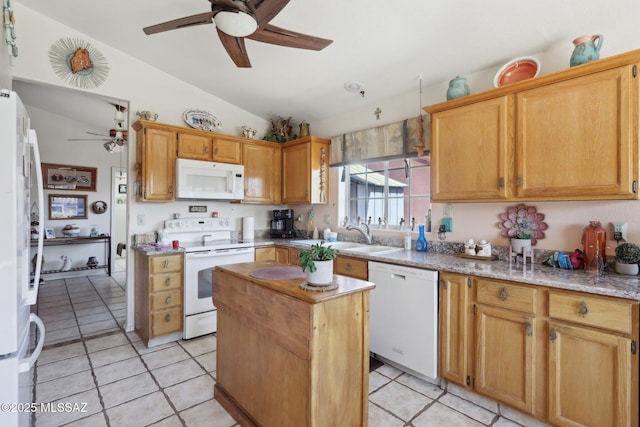 kitchen with lofted ceiling, white appliances, a center island, a sink, and ceiling fan