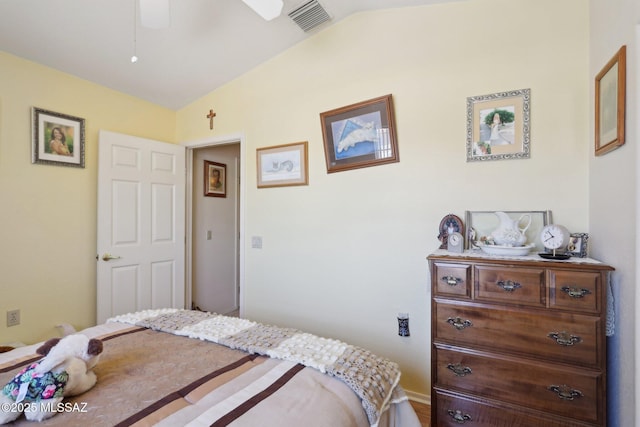 bedroom with vaulted ceiling and visible vents