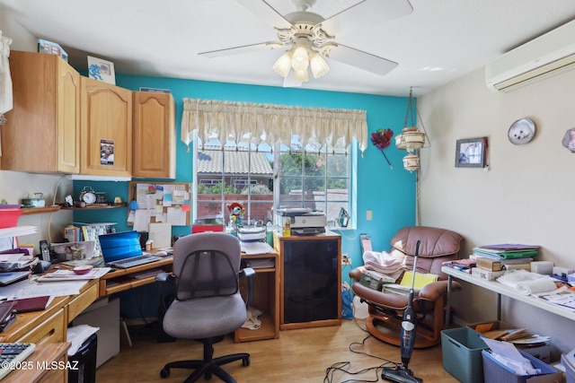 office area with light wood-style flooring, an AC wall unit, and ceiling fan